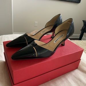 Manila Blahnik 2 inch covered Heel pump.